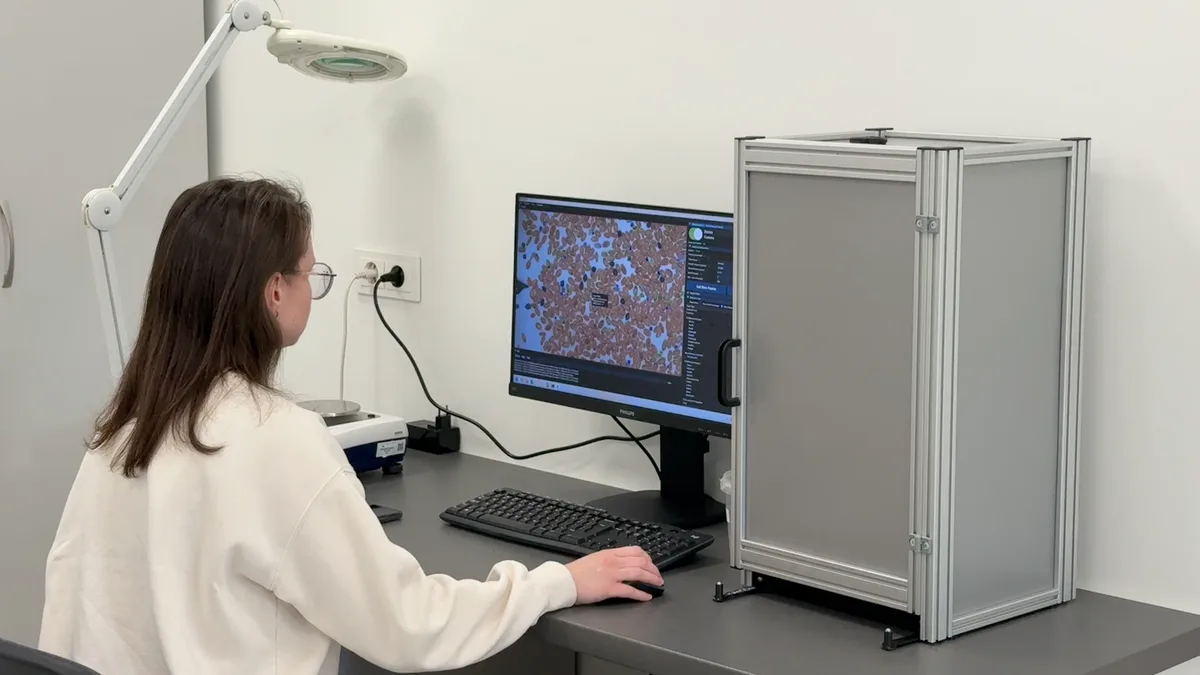 A GrainODM specialist running the imaging unit during testing at Sekargas Hamilton